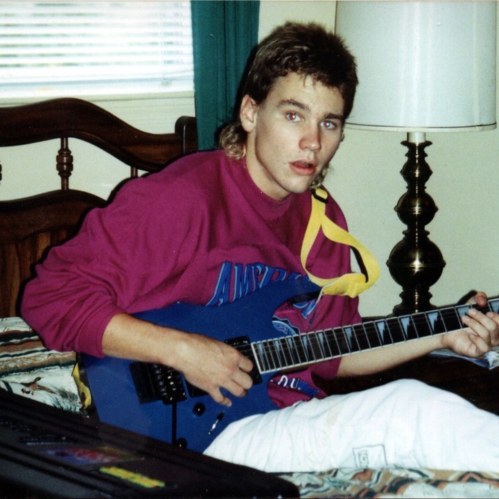 Young JR with blue guitar, circa 1990